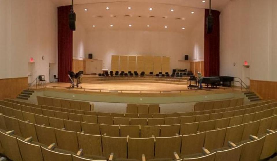 Theater with stage and fixed seating